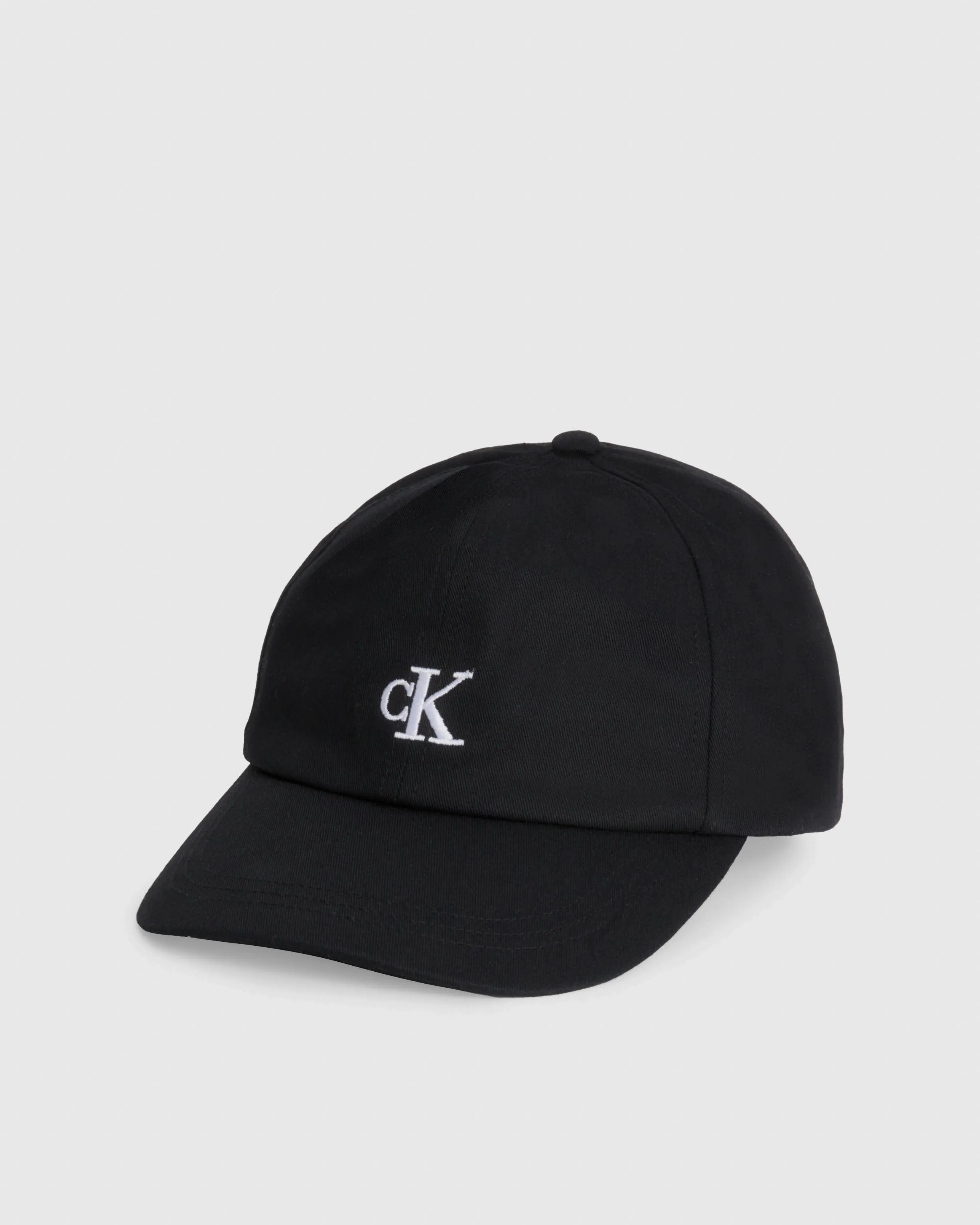 Black cotton cap with white monogram logo visor M-XL.