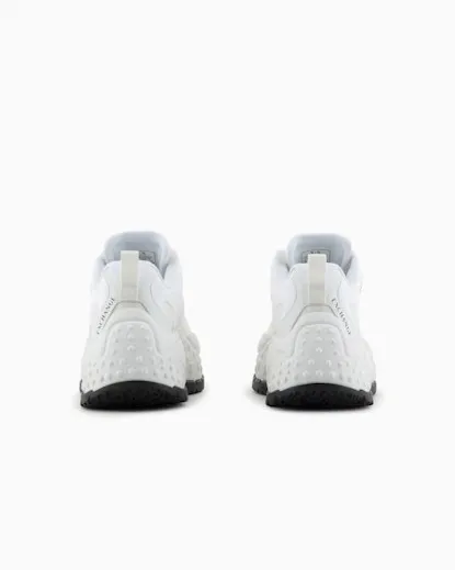 White mesh sneakers with contrasting logo lettering and high running sole.